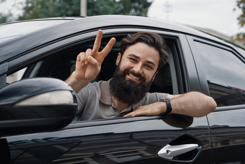 Happy Man on a Rental Car in Mexico